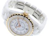 an image of a close up of a wrist watch on a white surface