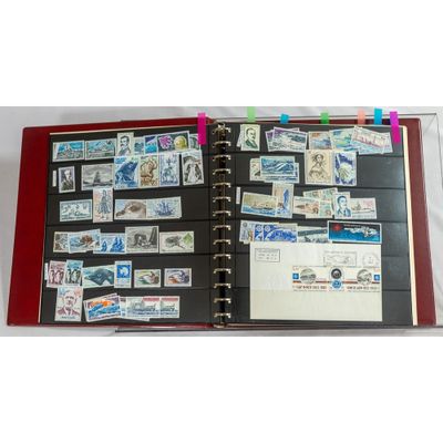 a book with stamps on it and a binder on top of it