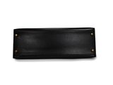 a black leather wallet with brass hardware on a white background
