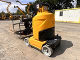 a yellow machine that is sitting in the dirt