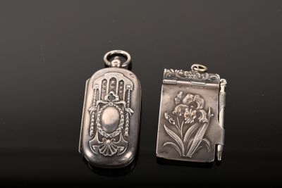 two silver lockes sitting on top of a table next to each other