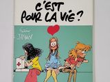 un livre sur lequel figure une illustration représentant trois filles assises sur un banc