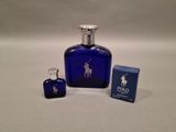 blue glass bottle with a silver lid and a blue box with a polo logo