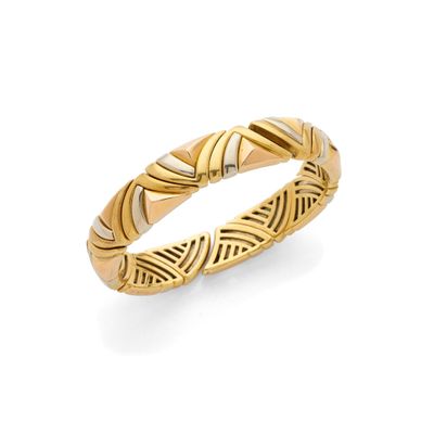 a close up of a gold ring on a white background
