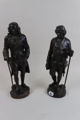 pair of bronze figurines of a man and a woman