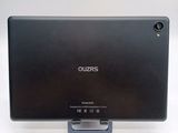 the back of a black tablet computer with a stand on a white surface