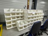 many bins on the table in the warehouse