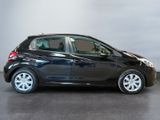 a picture of a small black car parked in a garage