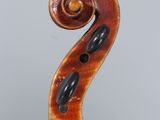 an old violin with a wooden back and a long neck