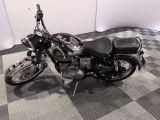 a motorcycle that is sitting on a checkered floor