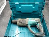 an image of a drill in a tool box with a tool in it