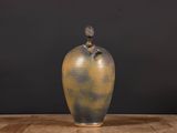 an image of a vase on a table with a black background