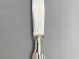 a knife that is sitting on top of a table