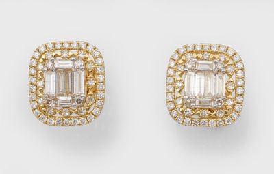 a pair of emerald and diamond earrings