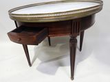 an image of a table with a drawer underneath it