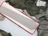 a box of clothing and a pair of scissors on a table