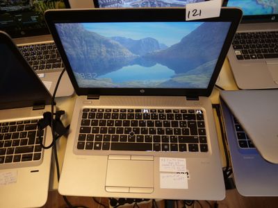 three laptops that are sitting on a table