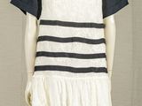 an image of a mannequin wearing a white and black dress