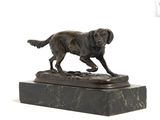 statue of a dog on a marble base on a white background