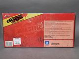 the back of a red box with a black and yellow label on it