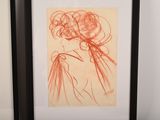 two framed drawings of a woman and a man