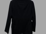 a black jacket on a hanger against a gray background