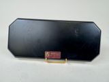 a close up of a black case on a white surface