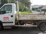 a white truck that is parked on the side of the road