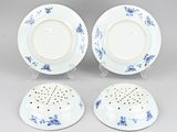 three blue and white porcelain plates and a saucer
