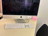 a computer on a desk with a keyboard and mouse