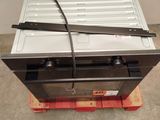 an image of a metal oven sitting on top of a pallet