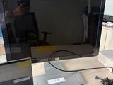 two laptops and a monitor on a desk