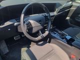 the interior of a car with a steering wheel and dashboard