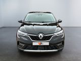 the front view of a black car in a white room