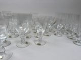 many empty wine glasses lined up on the table