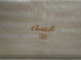 a close up of a white suitcase with a name on it