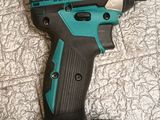 a close up of a cordless drill on a tile floor