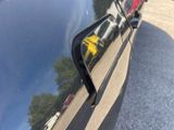 a reflection of a person in the side mirror of a car
