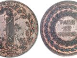 two different types of coins with a picture of a sword on one of them