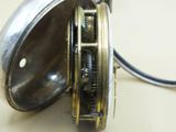 a close up of a pocket watch on a table