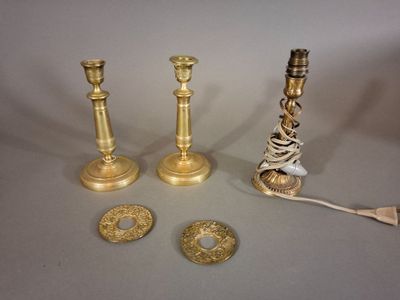 three candles that are sitting on a table next to each other