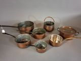 many pots and pans that are on the table