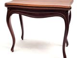 a small table with a wooden top on a white background