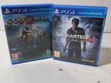 two ps4 games on a white table with a white background