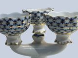 two white vases with blue and gold designs on them