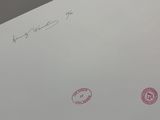 a piece of paper with stamps on it with a handwritten message on it