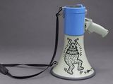a blue and white megaphone with a black strap on it