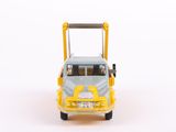 a toy truck that is sitting on a white surface