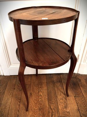 a small wooden table with a shelf on it