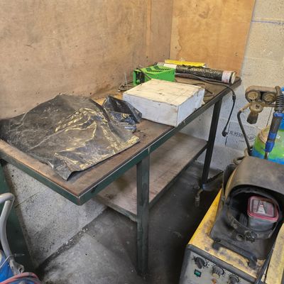 a table that has a lot of tools on it